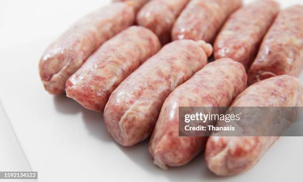 breakfast sausages against a white background - bratwurst stock pictures, royalty-free photos & images