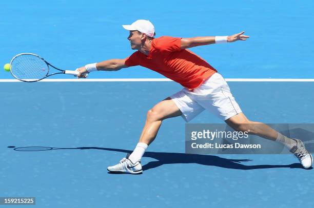 Tomas Berdych of Czech Republic plays a backhand during his match against Lleyton Hewitt of Australia during day two of the AAMI Classic at Kooyong...