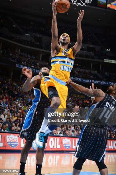 Corey Brewer of the Denver Nuggets goes to the basket during the game between the Orlando Magic and the Denver Nuggets on January 9, 2013 at the...