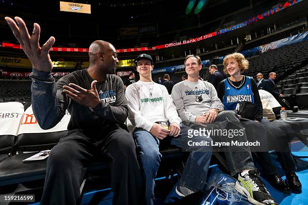 Shawn Respert, player development coach for the Minnesota Timberwolves, left, speaks with Cody Metz, center, and his family, who were in attendance...