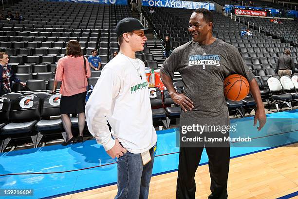 Dunn, assistant coach for the Minnesota Timberwolves, right, speaks with Cody Metz, in attendance through the Make-A-Wish Foundation, before a game...