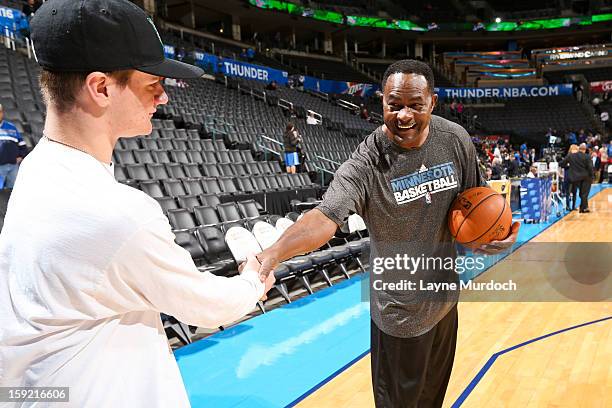 Dunn, assistant coach for the Minnesota Timberwolves, right, greets Cody Metz, in attendance through the Make-A-Wish Foundation, before a game...
