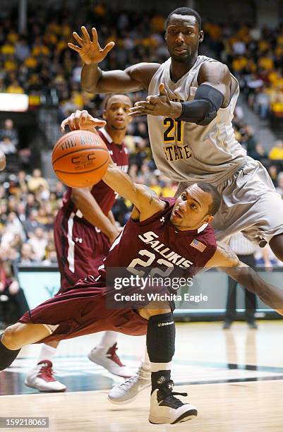 Southern Illinois' Jeff Early can't control the ball as he's pressured by Wichita State's Ehimen Orukpe in the first half at Koch Arena in Wichita,...