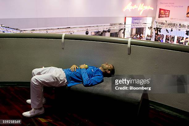 Representative for Samsung Electronics Co. Rests during the 2013 Consumer Electronics Show in Las Vegas, Nevada, U.S., on Wednesday, Jan. 9, 2013....