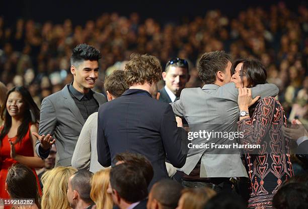 The Wanted band members react in the audience after hearing they won the Favorite Breakout Artists Award at the 39th Annual People's Choice Awards at...