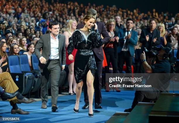 Actors Josh Hutcherson, Jennifer Lawrence, Liam Hemsworth walk onstage at the 39th Annual People's Choice Awards at Nokia Theatre L.A. Live on...