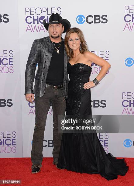 Country music singer Jason Aldean and wife Jessica Aldean arrive for the 2013 People’s Choice Awards at the Nokia Theatre in Los Angeles, California,...