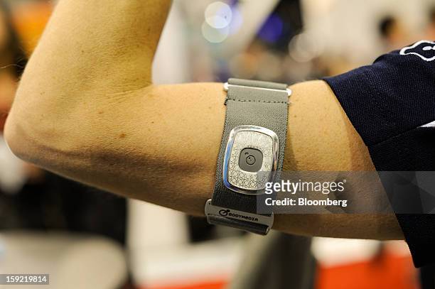 The BodyMedia Inc. Fitness Armband is arranged for a photograph during the 2013 Consumer Electronics Show in Las Vegas, Nevada, U.S., on Wednesday,...