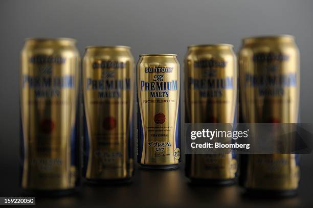 Cans of Suntory Holdings Ltd. Premium Malt's beer are arranged for a photograph in Kawasaki, Kanagawa Prefecture, Japan, on Wednesday, Jan. 9, 2013....