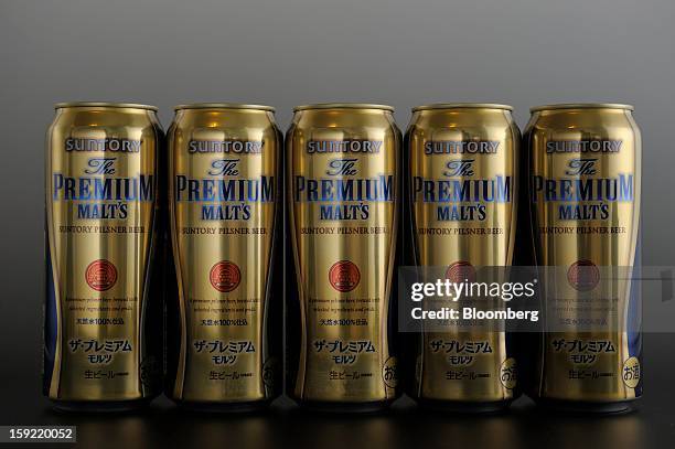 Cans of Suntory Holdings Ltd. Premium Malt's beer are arranged for a photograph in Kawasaki, Kanagawa Prefecture, Japan, on Wednesday, Jan. 9, 2013....