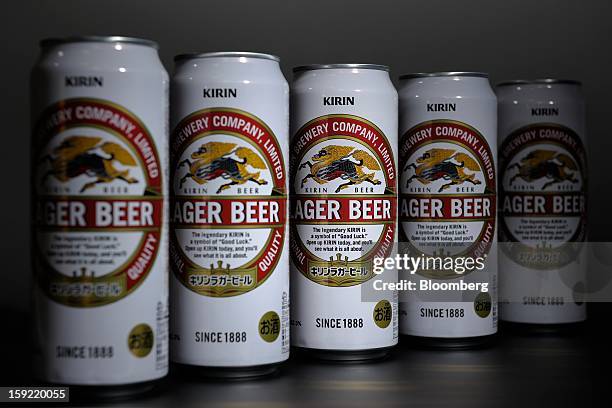 Cans of Kirin Brewery Co. Beer are arranged for a photograph in Kawasaki, Kanagawa Prefecture, Japan, on Wednesday, Jan. 9, 2013. Suntory, Kirin...