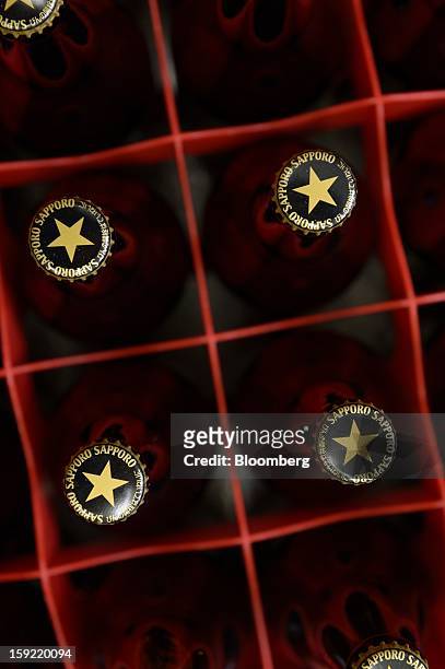Bottles of Sapporo Breweries Ltd. Beer are arranged for a photograph in Kawasaki, Kanagawa Prefecture, Japan, on Wednesday, Jan. 9, 2013. Sapporo is...