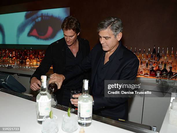 Casamigos Tequila founders Rande Gerber and George Clooney celebrate the launch of Casamigos at Andrea's at Encore Las Vegas on January 9, 2013 in...