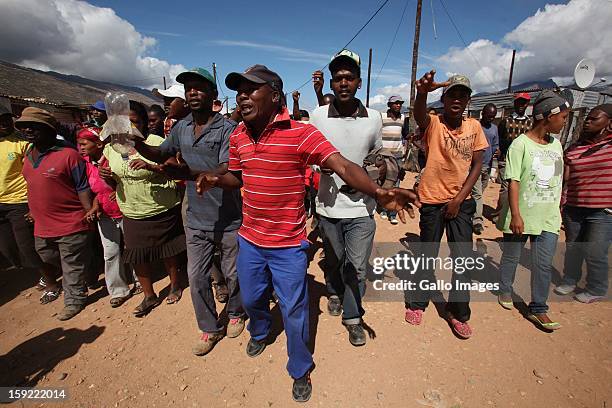 Farm workers march in Stofland gathering more farm workers on January 9 in Cape Town, South Africa. The farm workers of De Doorns protested for wages...