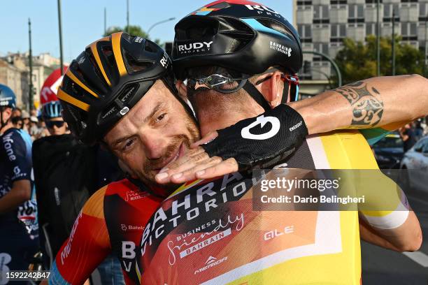 Race winner Matej Mohorič of Slovenia - Yellow leader jersey and Damiano Caruso of Italy and Team Bahrain - Victorious react after the 80th Tour de...