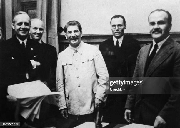 German Nazi Foreign Minister Joachim Von Ribbentrop , German Under State Secretary Friedrich Gaus, Soviet head of state Joseph Stalin and his Foreign...
