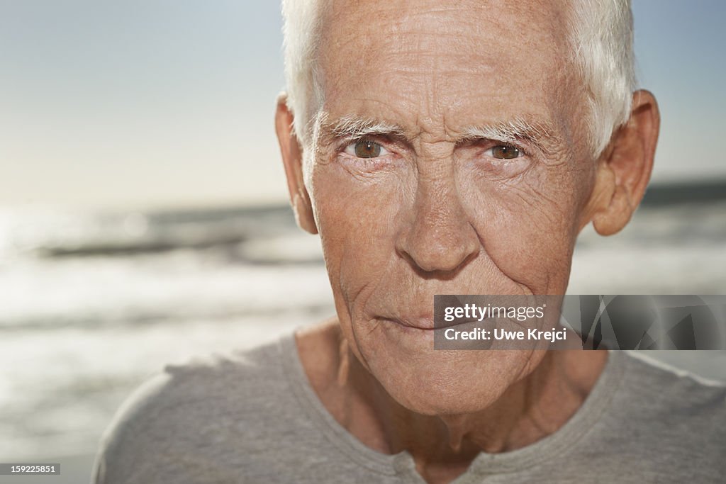 Portrait of a mature man on beach, close up