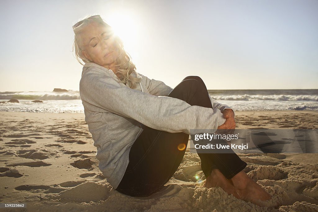 Portrait of mature woman relaxing on beach