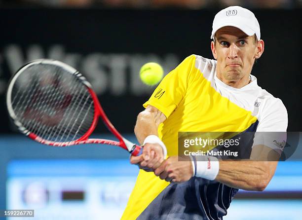 Jarkko Nieminen of Finland plays a backhand in his quarter final match against Bernard Tomic of Australia during day five of the Sydney International...