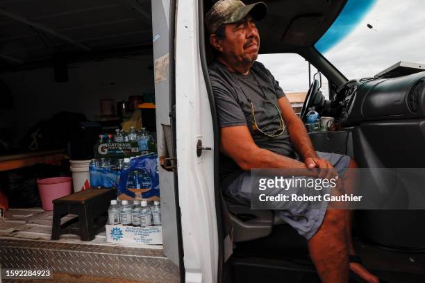 Maalaea, Maui, Thursday, August 10, 2023 - Jesus Vasquez sits in his van waiting to return to his home near Lahaina. He and other evacuees camped in...