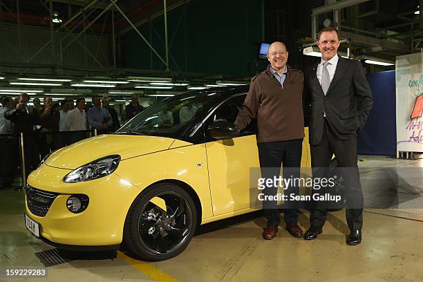 Steve Girsky , General Motors Vice Chairman and head of GM Europe, and Thomas Sedran, Deputy Chairman of Adam Opel AG, stand next to an Opel Adam car...