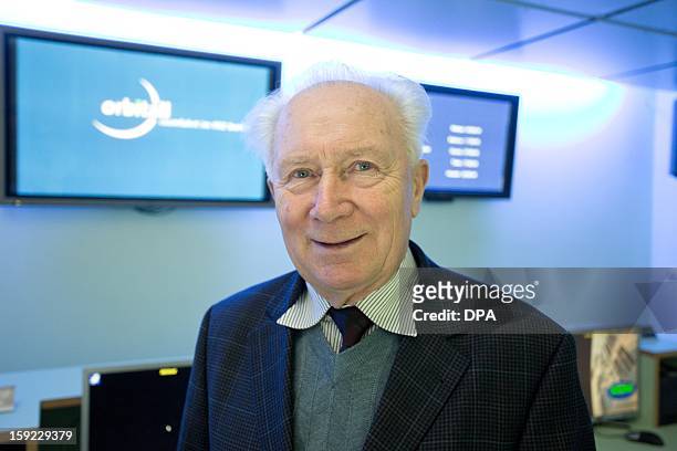 German cosmonaut Sigmund Jaehn poses on January 10, 2013 at the orbitall space center of the FEZ youth education and leisure park in Berlin on the...