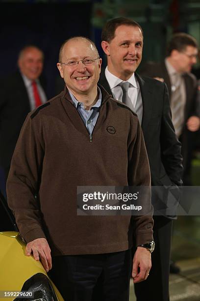 Steve Girsky , General Motors Vice Chairman and head of GM Europe, and Thomas Sedran, Deputy Chairman of Adam Opel AG, stand next to an Opel Adam car...