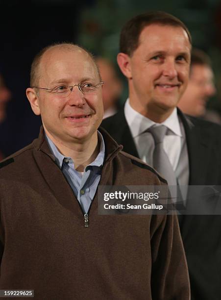 Steve Girsky , General Motors Vice Chairman and head of GM Europe, and Thomas Sedran, Deputy Chairman of Adam Opel AG, stand next to an Opel Adam car...