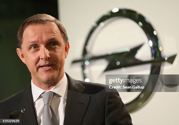 Thomas Sedran, Deputy Chairman of Adam Opel AG, speaks next to the Opel logo during a celebration to mark the launch of the new Opel Adam compact car...