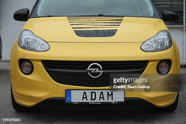 Finished Opel Adam car stands parked at a factory parking lot shortly after a celebration to mark the launch of the new Opel compact car at the Opel...