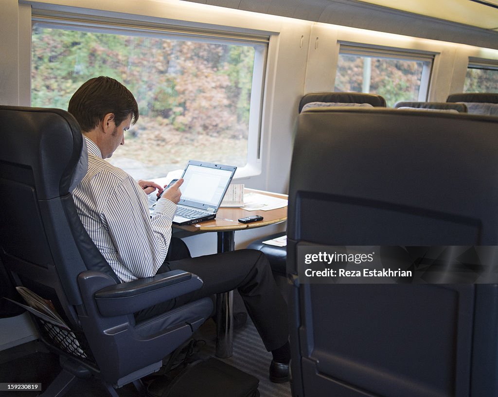 Businessman checks mobile phone