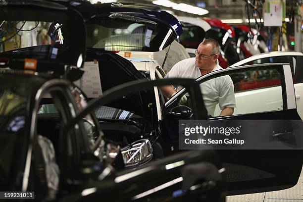 Worker assemble Opel Adam and Corsa cars at the Opel factory on January 10, 2013 in Eisenach, Germany. Opel employees hope the new Adam car will help...