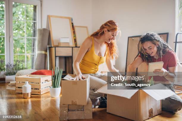 couple moving in new home - lesbian stock pictures, royalty-free photos & images
