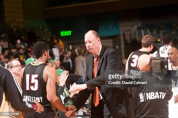 Reno Bighorns head coach Paul Mokeski shakes hands with members of the Erie BayHawks following their game during the 2013 NBA D-League Showcase on...