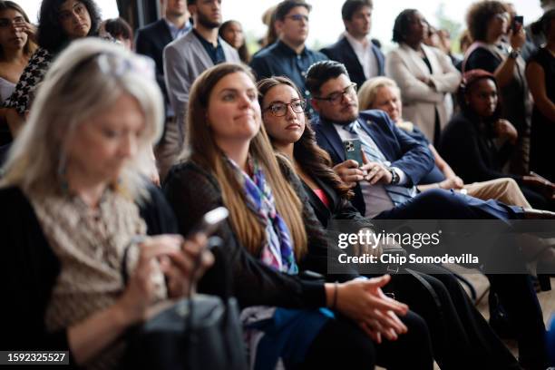 Guests listen to U.S. Vice President Kamala Harris address an event at Sycamore & Oak, a minority-owned retail village that houses other local small...