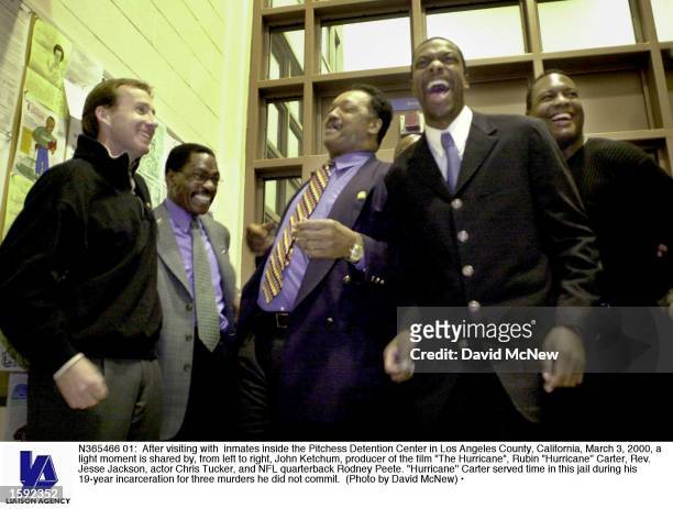 After visiting with inmates inside the Pitchess Detention Center in Los Angeles County, California, March 3 a light moment is shared by, from left to...