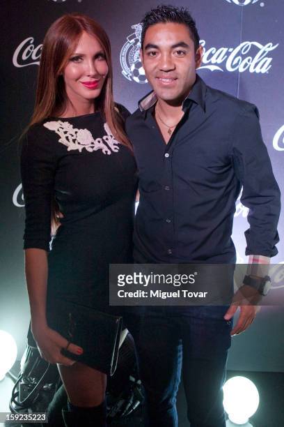 Soccer player Marco Fabian and his girlfriend posses during the red carpet of Oro documentary film on January 09, 2013 in Mexico City, Mexico. The...