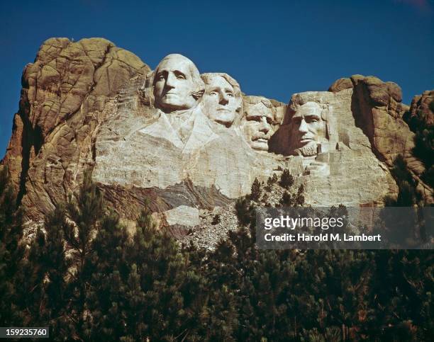 The Mount Rushmore National Memorial in South Dakota, USA, featuring the carved stone faces of US Presidents George Washington, Thomas Jefferson,...