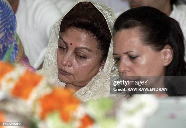 Madhavi Raje , the widow of Madhav Rao Scindia, and Congress Party President Sonia Gandhi sit near the body of the late Congress party deputy leader...