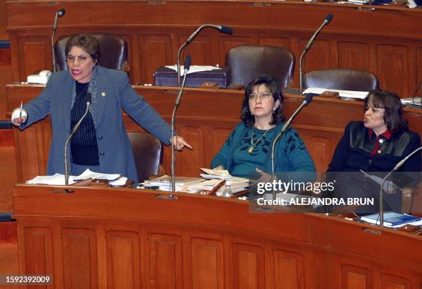 Fujimorist congresswomen Luz Salgado, Marta Chavez, and Carmen Lozada participate in a Peruvian congressional session in Lima on August 16, 2001...