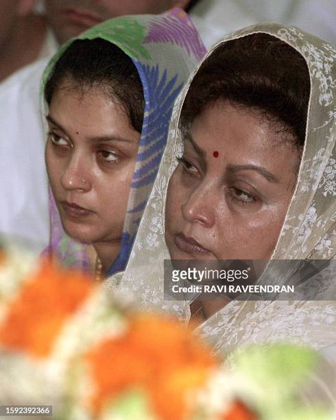 Madhavi Raje , the widow of Madhav Rao Scindia, and her daughter Chitrangada sit near the body of the late Congress party deputy leader at party...