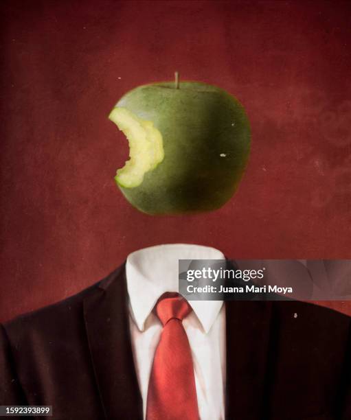 body of man in suit, head is a bitten apple. imitation of a surrealist painting by rene magritte. - surrealismo fotografías e imágenes de stock