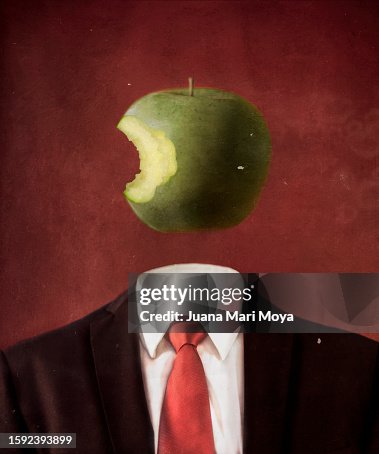 Body of man in suit, head is a bitten apple. Imitation of a surrealist painting by Rene Magritte.