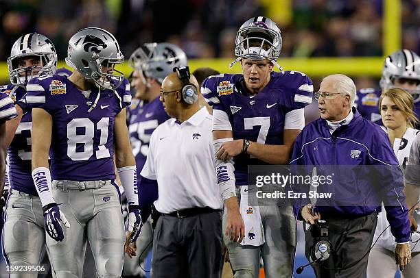 Head coach Bill Snyder talks to Collin Klein of the Kansas State Wildcats during the Tostitos Fiesta Bowl against the Oregon Ducks at University of...