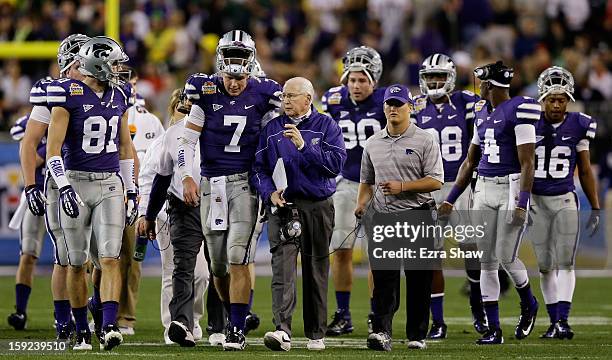 Head coach Bill Snyder talks to Collin Klein of the Kansas State Wildcats during the Tostitos Fiesta Bowl against the Oregon Ducks at University of...