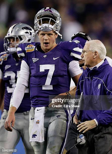 Head coach Bill Snyder talks to Collin Klein of the Kansas State Wildcats during the Tostitos Fiesta Bowl against the Oregon Ducks at University of...