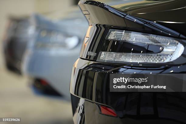 Aston Martin motor cars sit in the foyer at the headquarters and production plant of Aston Martin on January 10, 2013 in Gaydon, England. The iconic...