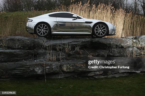 An Aston Martin motor car is displayed outside the company headquarters and production plant on January 10, 2013 in Gaydon, England. The iconic...