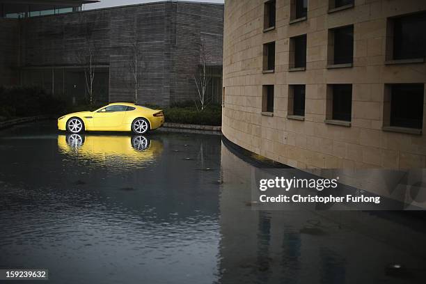 An Aston Martin motor car is displayed outside the company headquarters and production plant on January 10, 2013 in Gaydon, England. The iconic...