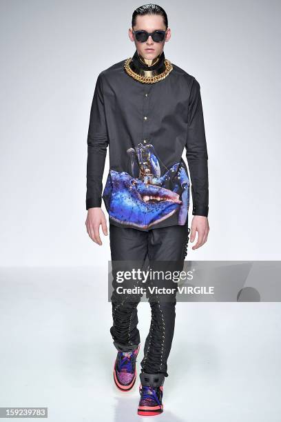 Model on the catwalk during the Katie Eary Ready to wear Fall/Winter 2013-2014 show at the London Collections: MEN AW13 at The Hospital Club on...